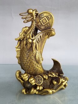 ปลาหัวมังกร คาบเหรียญเงิน สัตว์มงคลเสริมทรัพย์สินเงินทอง,ความมั่งคั่งร่ำรวย